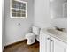 Bright bathroom featuring a vanity, toilet, mirror, and window with natural light at 120 Apache Dr, Summerville, SC 29483