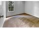 Empty bedroom features neutral carpet and bright window at 120 Apache Dr, Summerville, SC 29483