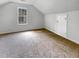 Attic bedroom features neutral carpet and bright window at 120 Apache Dr, Summerville, SC 29483