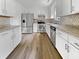 Modern kitchen with white cabinets, stainless steel appliances, countertops, and wood flooring at 120 Apache Dr, Summerville, SC 29483