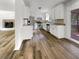 Bright kitchen featuring white cabinetry, stainless steel appliances, and wood-look flooring at 120 Apache Dr, Summerville, SC 29483