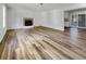 Spacious living room boasts a fireplace and beautiful wood-look flooring at 120 Apache Dr, Summerville, SC 29483