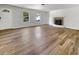 Bright living room with wood floors, a fireplace, and natural light from windows and door at 120 Apache Dr, Summerville, SC 29483