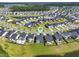 Serene aerial perspective captures a well-planned community featuring lakes, green spaces, and lush surroundings at 120 Haverhill St, Summerville, SC 29486