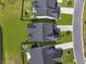 Aerial shot showcasing a home with a perfectly manicured lawn nestled in a residential community at 120 Haverhill St, Summerville, SC 29486