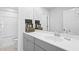 Well-lit bathroom with white countertops, gray cabinets, and a large mirror at 120 Haverhill St, Summerville, SC 29486