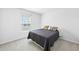 A minimalistic bedroom design with a small window and a comfortable bed with decorative pillows at 120 Haverhill St, Summerville, SC 29486