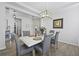 Dining room featuring hardwood floors, modern chandelier, and seating for six at 120 Haverhill St, Summerville, SC 29486