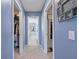 Hallway with blue walls with door leading to closet and door leading to bathroom at 120 Haverhill St, Summerville, SC 29486
