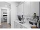 Hallway features a wet bar setup and an office workspace for functionality at 120 Haverhill St, Summerville, SC 29486