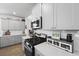 Kitchen with white subway tile backsplash, stainless steel appliances, and light grey cabinets at 120 Haverhill St, Summerville, SC 29486