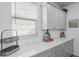 Kitchen featuring white subway tile backsplash, bright natural lighting, and light grey cabinets at 120 Haverhill St, Summerville, SC 29486