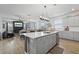 Open-concept kitchen with a large island, stainless steel appliances, and hardwood floors at 120 Haverhill St, Summerville, SC 29486