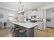 Kitchen with a large island, stainless steel appliances, pendant lighting, and sleek countertops at 120 Haverhill St, Summerville, SC 29486