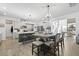 Modern kitchen features white cabinets, granite countertops, an island, and hardwood floors at 120 Haverhill St, Summerville, SC 29486