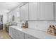 Kitchen featuring white cabinets, subway tile backsplash, and decorative accents at 120 Haverhill St, Summerville, SC 29486