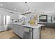 Kitchen featuring stainless steel appliances, a marble countertop island, and grey wood flooring at 120 Haverhill St, Summerville, SC 29486