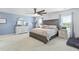 Serene main bedroom with lots of windows and natural light, featuring a large bed and ceiling fan at 120 Haverhill St, Summerville, SC 29486
