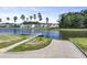 Scenic pond with a boat ramp and a floating dock against a backdrop of neighborhood homes at 120 Haverhill St, Summerville, SC 29486