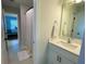 Bright bathroom showcasing a white vanity with gold hardware and a linen closet, providing ample storage space at 122 Riley Farms Ct, Summerville, SC 29486