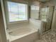 Bathroom with a shower, tub, and window at 122 Riley Farms Ct, Summerville, SC 29486