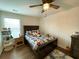Charming bedroom boasts hardwood floors, a ceiling fan, and is decorated with colorful sports-themed bedding and décor at 122 Riley Farms Ct, Summerville, SC 29486