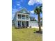 Charming two-story home featuring a spacious porch, rocking chairs, and a well-manicured lawn at 122 Riley Farms Ct, Summerville, SC 29486