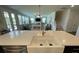 Stylish kitchen island with seating and open layout, providing a view to the living area at 122 Riley Farms Ct, Summerville, SC 29486