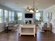 Inviting living room with a fireplace, comfortable sofas, and plenty of natural light at 122 Riley Farms Ct, Summerville, SC 29486