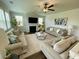 Spacious living room featuring modern decor, a cozy fireplace, and ample seating at 122 Riley Farms Ct, Summerville, SC 29486