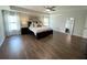 Large Primary bedroom with a ceiling fan and many windows for natural light at 122 Riley Farms Ct, Summerville, SC 29486