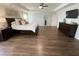 Primary bedroom with a ceiling fan, tray ceilings, and many windows for natural light at 122 Riley Farms Ct, Summerville, SC 29486