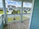 Charming front porch with views of a well-manicured lawn and neighborhood homes, enhancing curb appeal and outdoor enjoyment at 122 Riley Farms Ct, Summerville, SC 29486