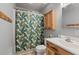 Bathroom featuring a tropical-themed shower curtain and a modern wooden vanity at 1248 Sumner Ave, North Charleston, SC 29406