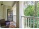 Inviting balcony with outdoor seating overlooking lush greenery, perfect for relaxing and enjoying the view at 1300 Park West Blvd # 512, Mount Pleasant, SC 29466