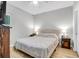 Bright bedroom with a queen bed, bedside tables with lamps, and neutral walls in a cozy setting at 1300 Park West Blvd # 512, Mount Pleasant, SC 29466