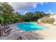 Large community pool with ample seating and shade, perfect for enjoying sunny days with friends at 1300 Park West Blvd # 512, Mount Pleasant, SC 29466