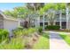 Well-maintained condo building exterior featuring lush landscaping and private balconies and patios at 1300 Park West Blvd # 512, Mount Pleasant, SC 29466
