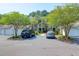Apartment building with garages, car parking, and well-kept landscaping at 1300 Park West Blvd # 512, Mount Pleasant, SC 29466