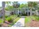 Charming condo community featuring lush landscaping, palm trees, and well-maintained walkways at 1300 Park West Blvd # 512, Mount Pleasant, SC 29466