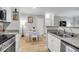 Modern kitchen that offers stainless steel appliances, bright countertops, and an eat-in dining space at 1300 Park West Blvd # 512, Mount Pleasant, SC 29466