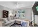 Comfortable living room features a large window and neutral decor at 1300 Park West Blvd # 512, Mount Pleasant, SC 29466