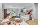 Open-concept living space with modern decor, dining area, a work space and ample natural light from large windows at 1300 Park West Blvd # 512, Mount Pleasant, SC 29466