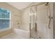 Modern bathroom featuring a glass shower and a separate bathtub at 1308 Wild Olive Dr, Mount Pleasant, SC 29464