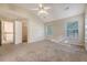Bright bedroom features carpet, ceiling fan, two windows, and walk in closet at 1308 Wild Olive Dr, Mount Pleasant, SC 29464