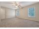 Spacious carpeted bedroom features natural light from two windows at 1308 Wild Olive Dr, Mount Pleasant, SC 29464