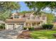 Charming two-story home with a manicured lawn, attached two-car garage, and inviting front porch at 1308 Wild Olive Dr, Mount Pleasant, SC 29464