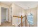 Upstairs landing featuring wood railing, a chandelier, and natural light at 1308 Wild Olive Dr, Mount Pleasant, SC 29464