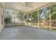 An open screened porch with a ceiling fan allows for relaxing and enjoying the outdoors at 1308 Wild Olive Dr, Mount Pleasant, SC 29464