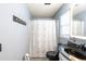 Bright bathroom offers a shower with decorative curtain and modern vanity at 137 Salem Creek Dr, Goose Creek, SC 29445